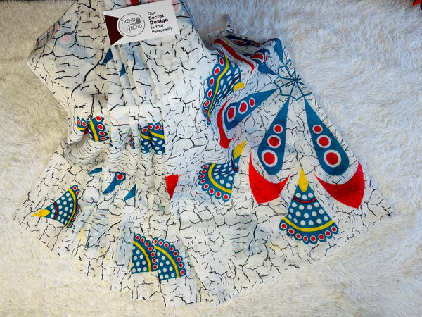 Colorful fabric with bell patterns on a textured surface