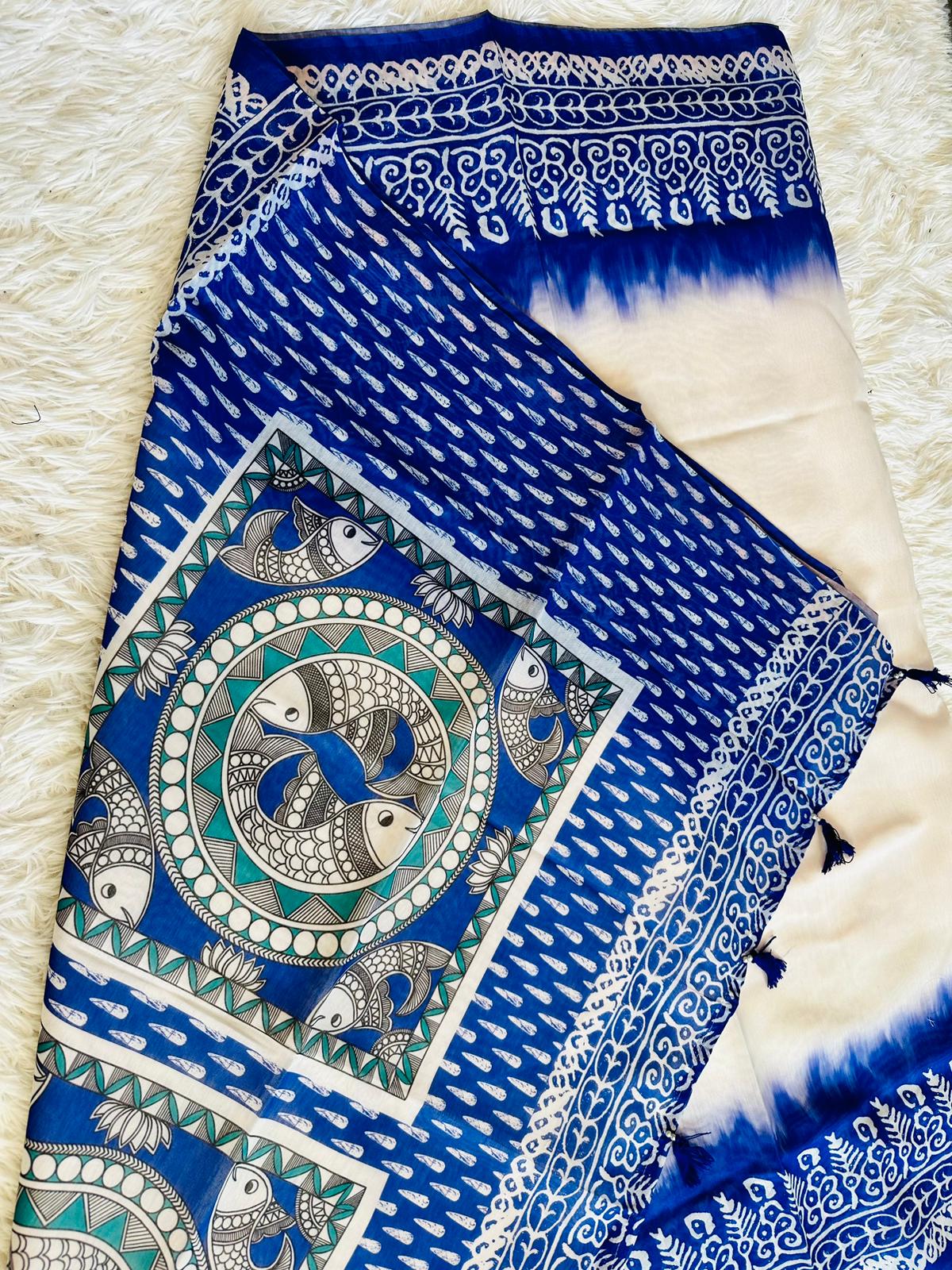 Blue and white patterned fabric on a white surface